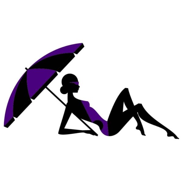 Woman Sunbathing On The Beach Under A Beach Umbrella