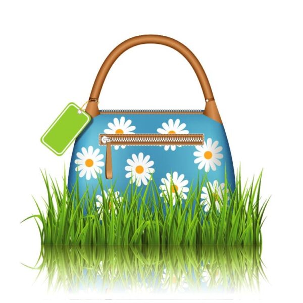 Blue woman spring bag with chamomiles flowers and sale label in grass lawn with reflection