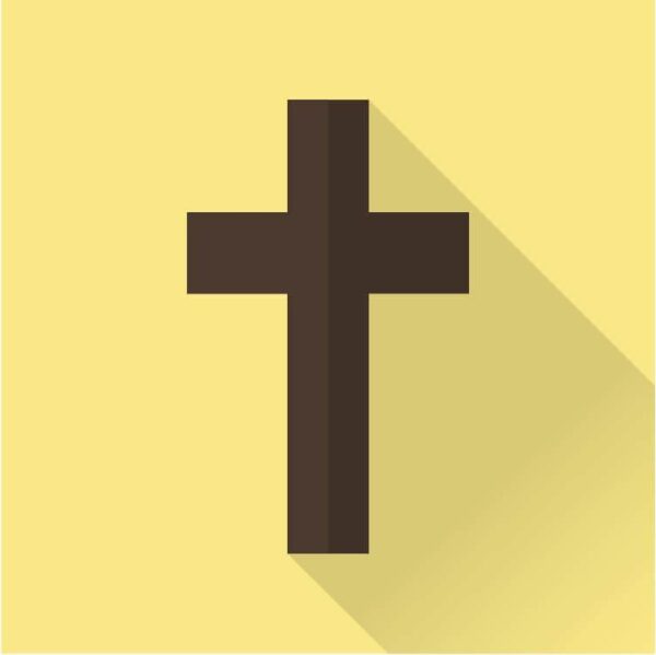 Brown cross with a shadow on a gold colored background