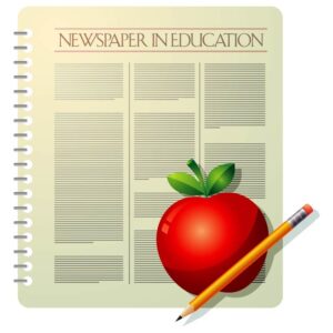 Newspaper in education with pencil and apple