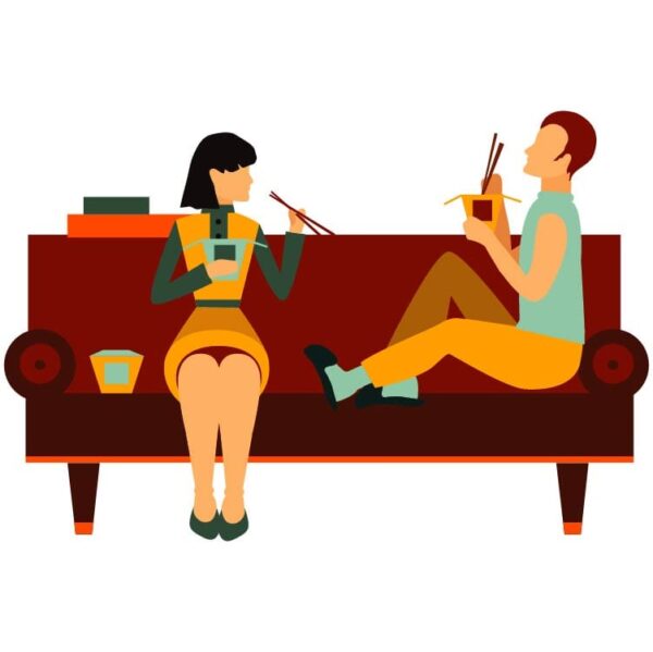 Couple sitting on sofa eating noodles flirting and talking about something