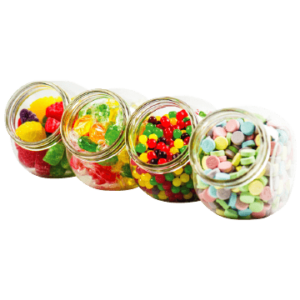 Glass jars filled with different colorful candies