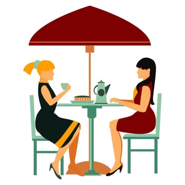 Two women sitting in street cafe and enjoying the coffee