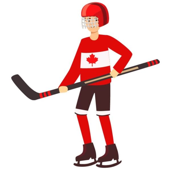 Young ice hockey player in canadian uniform standing and holding stick