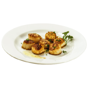 Scallops seared with herbs on plate