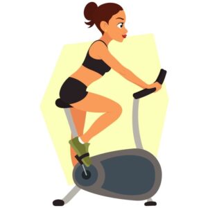 Young woman or girl training on an exercise bike working out in the fitness club or gym for healthy lifestyle
